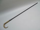 an old fashioned umbrella with a black handle on a white surface