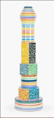 a multicolored vase with a lot of beads on it