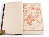 an open book with a picture of a man on a horse
