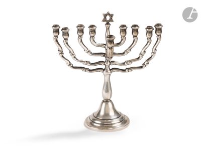 an image of a silver menorah with five candles on it