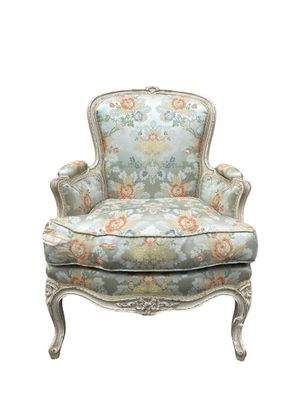an image of a chair with a floral upholstered back