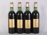 three bottles of wine sitting on top of a table next to each other