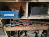 many tools that are sitting on a shelf in the garage