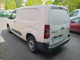 a white van that is parked on the side of the street