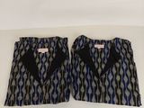 a pair of blue and black patterned shorts with black bow ties
