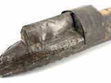 an old rusty pipe cutter on a white surface