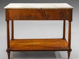 an old wooden table with a marble top on a gray background