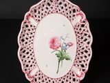 a close up of a plate with a flower on it