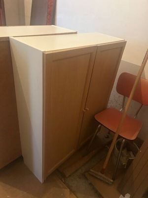 two chairs and a desk in a room that is under construction