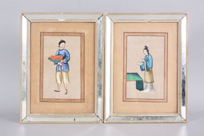 two framed pictures of a woman in a blue dress and a man in a blue shirt