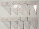 a lot of rulers that are on the wall