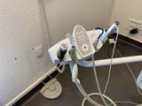 a machine that is sitting on the floor next to a wall