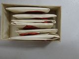 a box with a bunch of papers in it on a table