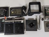 a lot of different types of cameras on the table