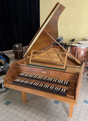 a piano that is sitting in the middle of a room