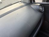 a view of a car ' s dashboard from inside the car