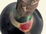 a bottle of wine with a cork sticking out of it