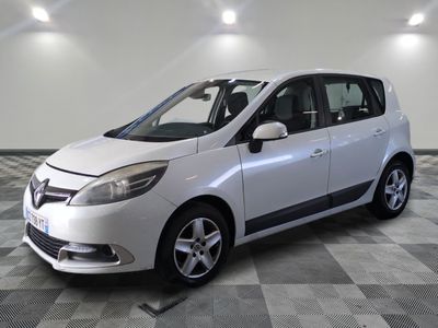 a picture of a white car parked in a garage