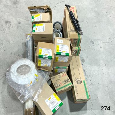 a pile of boxes and a roll of tape on the floor