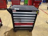 a close up of a tool cart in a garage with other tools