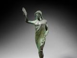 an image of a statue of a woman holding a mirror