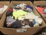 a cardboard box filled with clothes and other items