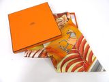 an orange box with a picture of a woman on it sitting on top of a table