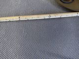 a measuring tape on the floor next to a cup of coffee