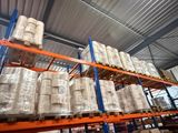 many rolls of paper on the shelves in the warehouse