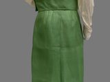 an image of a mannequin wearing a green skirt and white shirt