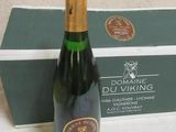 a bottle of wine sitting next to a box of wine