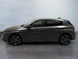 the grey car is parked on the concrete floor in the room