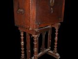 an old wooden cabinet with two doors and a drawer on top