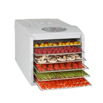 an image of a food dehyzer with fruits and vegetables in it