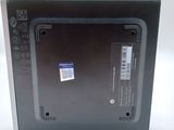 a black box with a sticker on it on a white surface