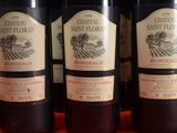 several bottles of wine are lined up on a table