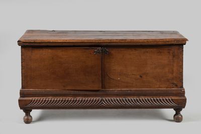 an old wooden chest with two doors and a drawer on the bottom