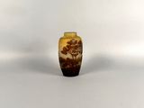 a small vase that is sitting on a white surface