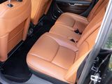 the interior of a car with tan leather seats and black trims