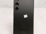 the back of a black cell phone with a camera attached to it