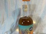 a bottle of liquor sitting on a table with a price tag