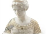a marble bust of a woman holding a book