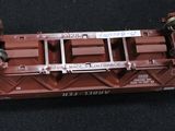 a close up of a red train car on a black surface