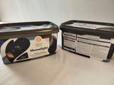 two containers of yogurt sitting on a table
