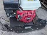a small engine sitting on top of a pallet
