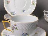 a cup and saucer set with a saucer and saucer