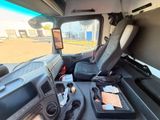 a seat in the back of a truck with a tray of food on it