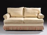 an image of a couch with a red and white striped skirt