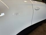 a close up of a car door with a sticker on it