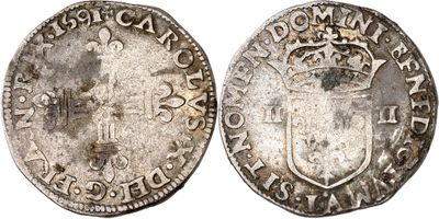 an old silver coin with a crown on the front and a shield on the back